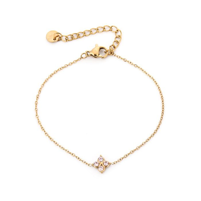 Klaver met oranje steentjes armband goud