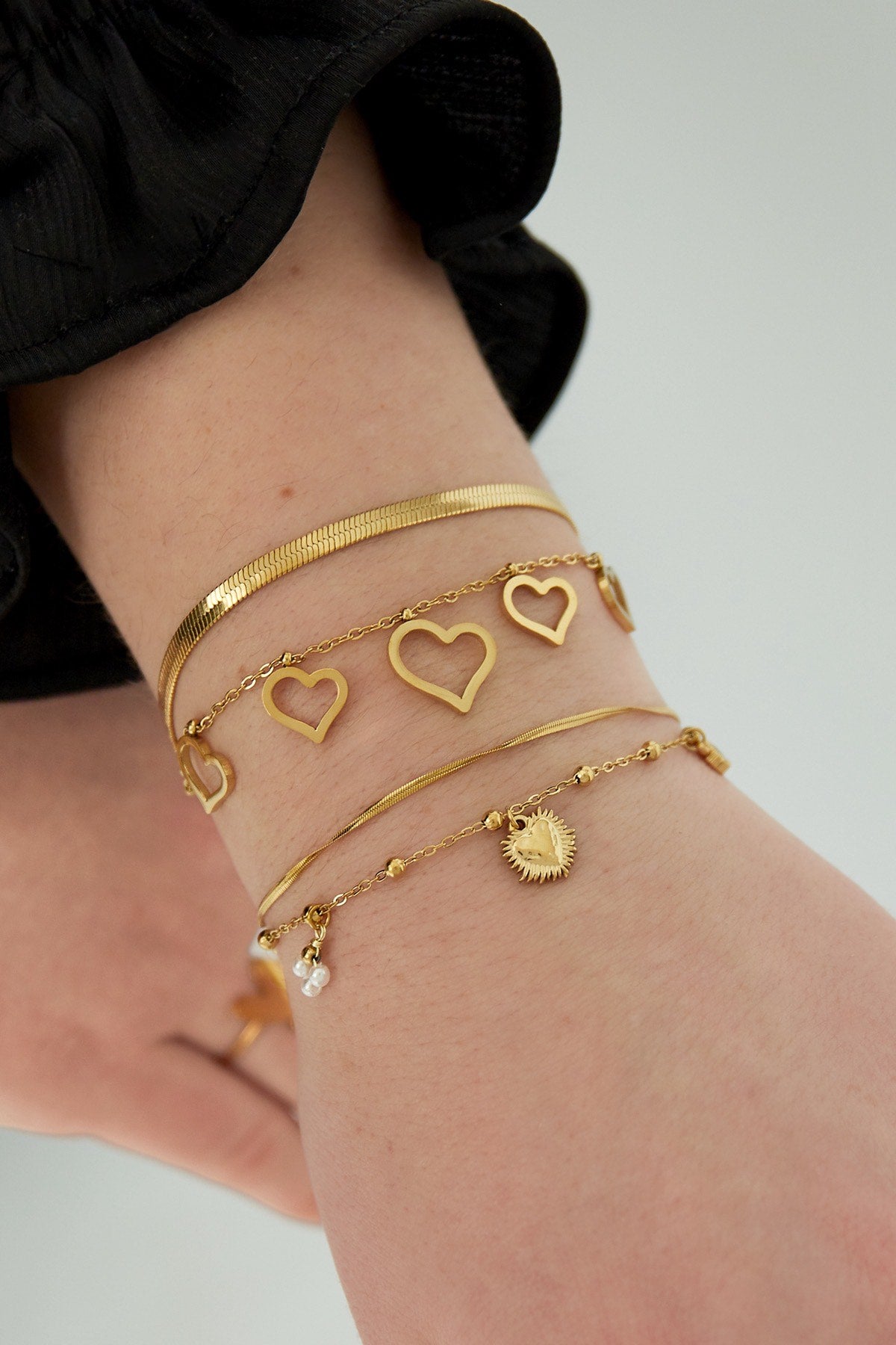 Dubbele armband met hart bedel goud